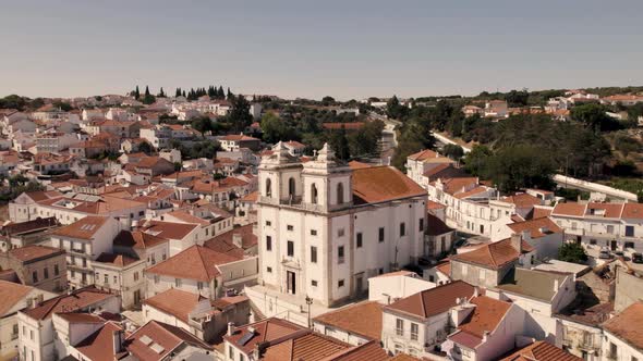 Santiago Church and Alcaçer do Sal white houses cityscape, Alentejo. Aerial view alt