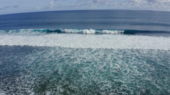 Slow Motion Top Down Aerial View of the Ocean Giant Waves Foaming and Splashing alt