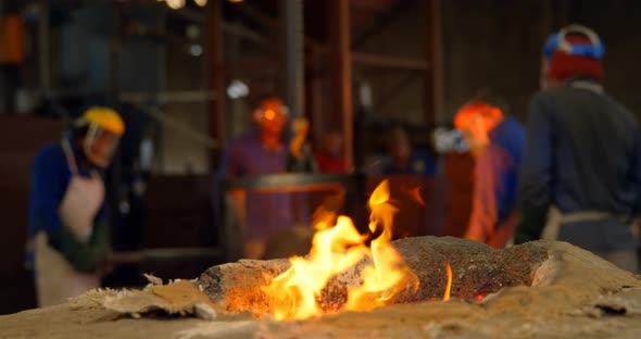 Close-up of fire flaming from furnace in foundry workshop 4k alt