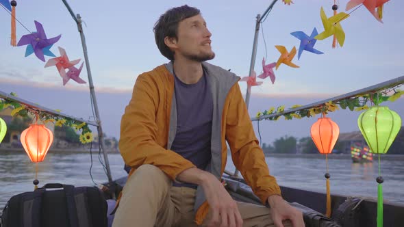 A Young Man Tourist Visits an Ancient Town of Hoi An in the Central Part of Vietnam alt