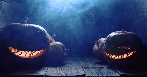 Creepy and strange Halloween pumpkin with smoke and light.