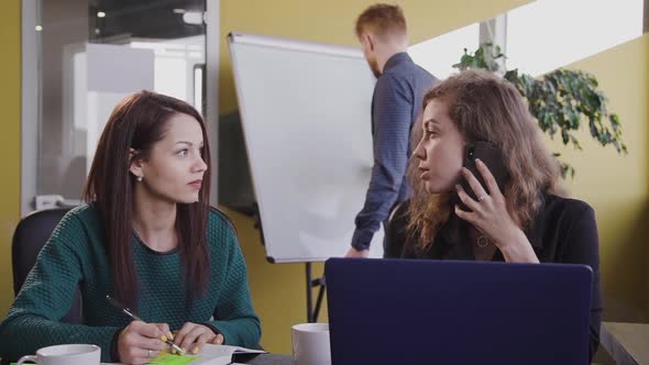 Female Office Worker Talk on Phone in Modern Office. alt