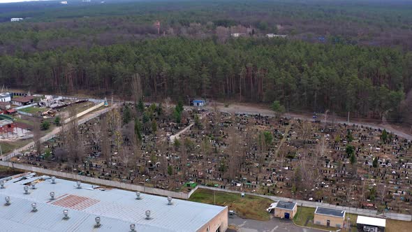 Top view of the cemetery in Gostomel. Aerial view of the destroyed and burnt houses.