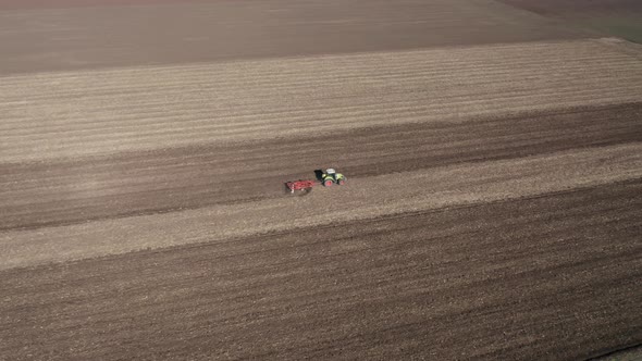 Moving tractor with plow alt