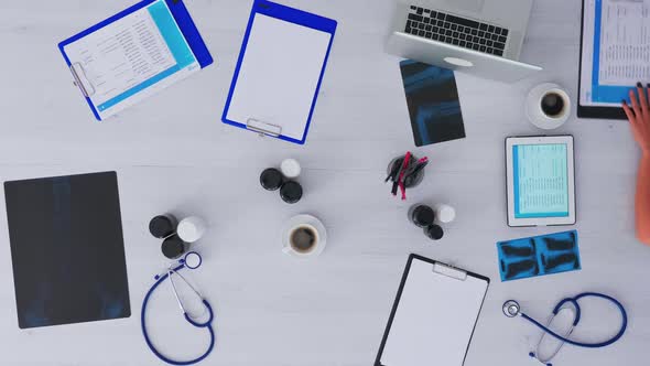 Medical Practitioner Checking Appointments Using Tablet alt