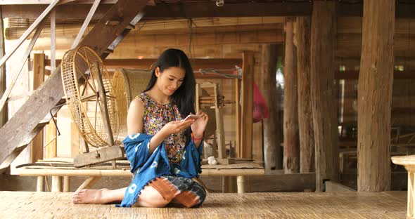 Rural Woman Touching A Smart Phone alt