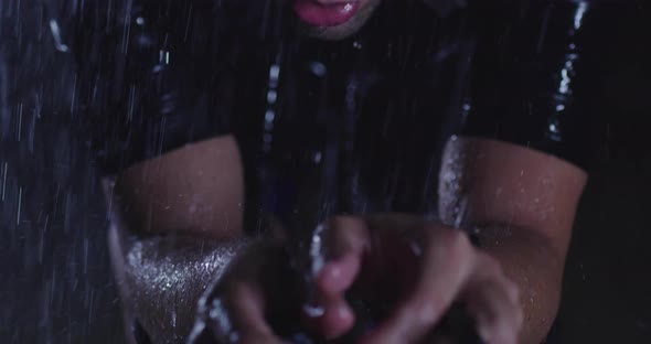 Triathlon Athlete Riding a Professional Racing Bicycle on an Intense Workout in Dark with Rain alt