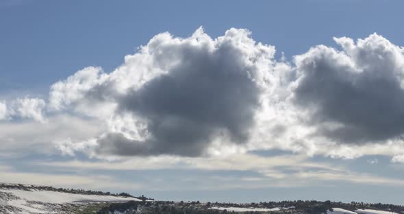 Time Lapse of Cloudscape Behind of the Mountains Top alt