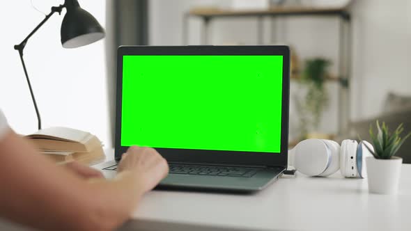 Laptop with Green Screen at Home alt
