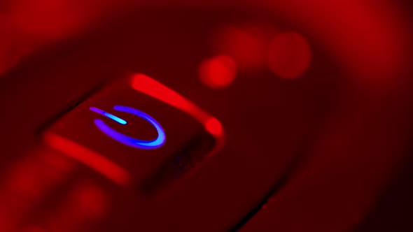 A Man Presses the Computer's Power Button and the Computer Starts. Then the Man Shuts Down the