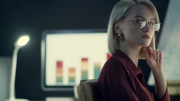 Overworked Business Woman Working on Computer in Night Office alt