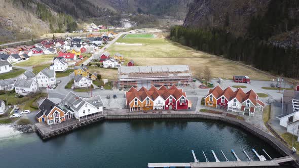 Modalen town center with a marina close to houses and a public beach - Norways richest municipality alt