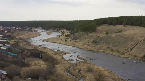 Aerial View of the River with Large Rocks in the Riverbed. alt