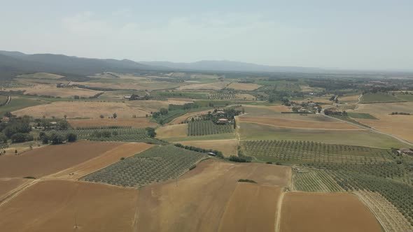 Aerial images of Tuscany in Italy cultivated fields summer, Aerial view of the vineyard hills in sou alt