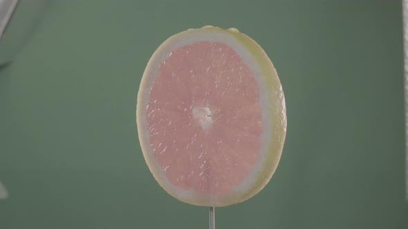 Grapefruit Rotating with Loop on Green Screen for Chroma Key alt
