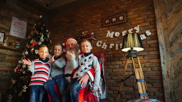 Three Boys Brothers Make Wishes To Santa Claus and Send Greetings with Congratulations for Upcoming