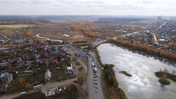 Aerial view of road construction work near the village. 32 alt