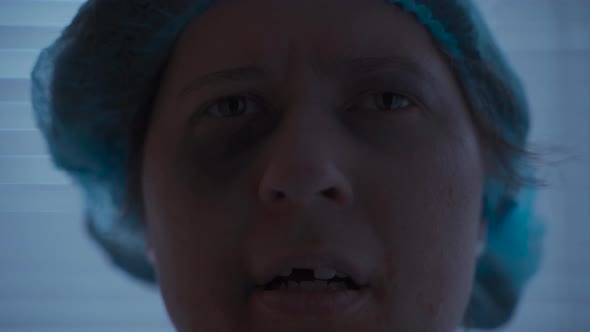 A Caucasian Woman with Facial and Dental Trauma and Injuries Looks Sadly at the Camera in Her alt