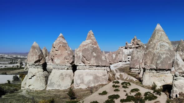 Admire Aerial Mesmerizing View of Natural Formations of Mountains in Cappadocia Taken From Air alt