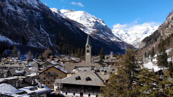 Aerial view of Alpine chapel in Gresonei Saint Jean Italy Aosta Valley. Winter season alt