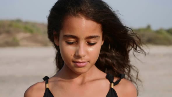 Portrait of Hispanic Teen Girl Slowly Opening Her Eyes and Looking Straight alt