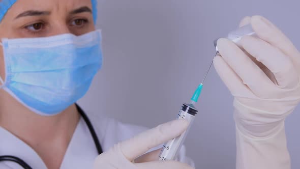 Doctor Filling the Syringe with Vaccine