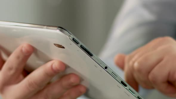 Close up Of Man's Hand Booking Hotel Apartment on Tablet, Mobile Application alt