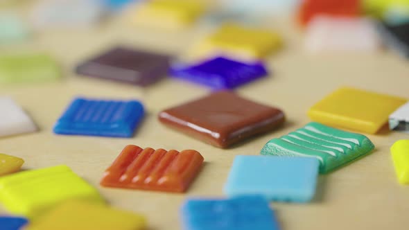 Detailed Macro Shot of Colorful Pieces of Glass or Ceramics for Creating Mosaic alt