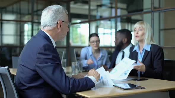 Male Company Director Slamming Hand Table Feeling Tired of Shouting Colleagues alt