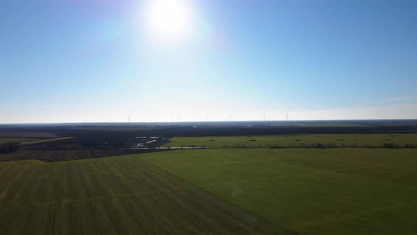 Aerial Drone View of Row of Windmills in the Field