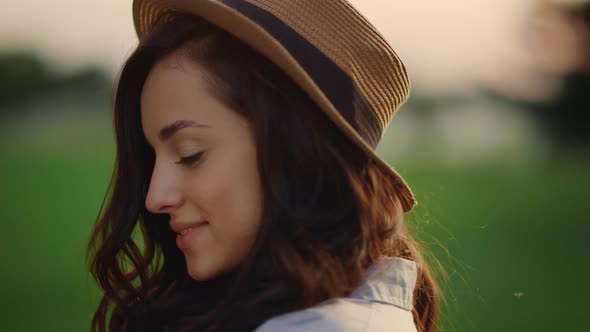 Sensual Woman Looking at Camera at Summer Park at Sunset. Model Girl Face alt