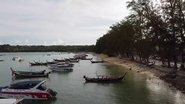 Fishing Boats Along a Tropical Coastline Aerial alt