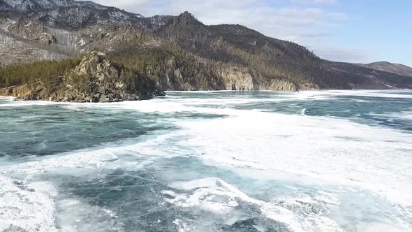 Beautiful landscape with a frozen winter lake alt
