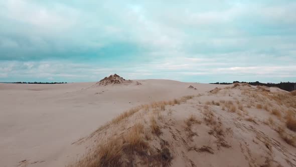 Sand dunes from drone. Amazing sea desert. Beautiful sky.