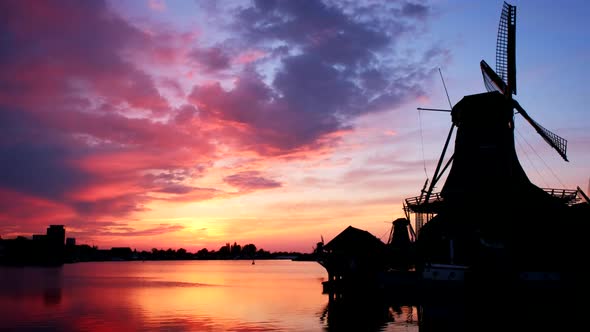 Windmills at Zaanse Schans in Holland on Sunset. Zaandam, Nether alt