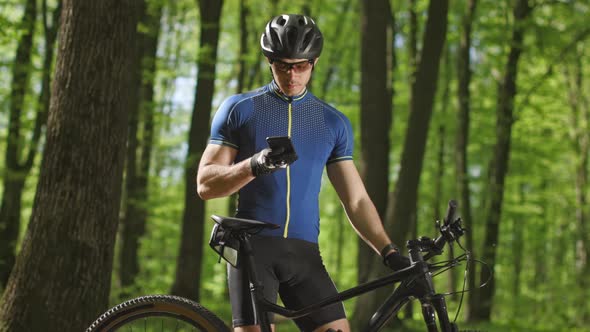 A Man is Looking Through Social Networks on a Smartphone alt