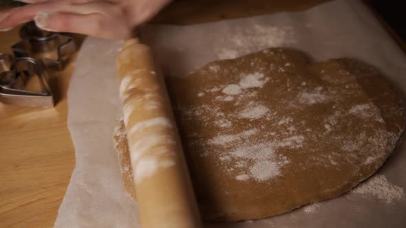 Women's Hands Make a Thin Layer of Dough for Cooking Gingerbread Ginger Cookies