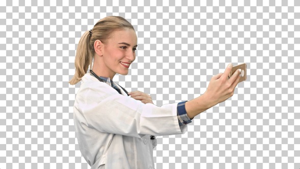 Young pretty female doctor makes selfie, Alpha Channel