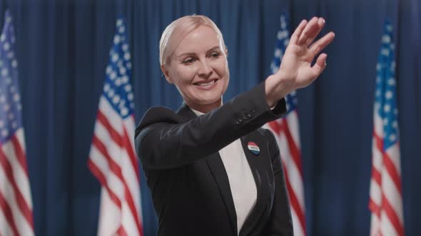 Female Candidate Waving Hand alt