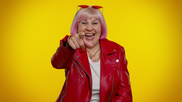 Elderly Amused Woman Pointing Finger to Camera Laughing Out Loud of Ridiculous Appearance Funny Joke alt