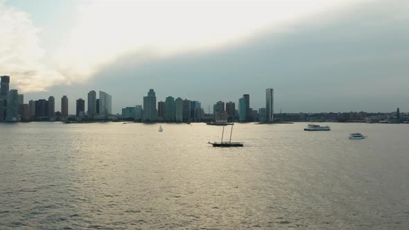 Aerial Drone Shot Approaching a Sailboat During Sunset (Hudson River, Manhattan, New York)