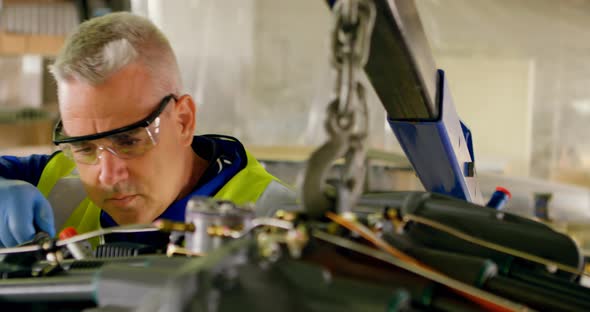 Engineer repairing aircraft engine 4k alt