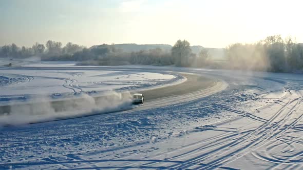 Slow Motion Aerial Shots of Winter Drift Competitions on the Ice of a Frozen Lake
