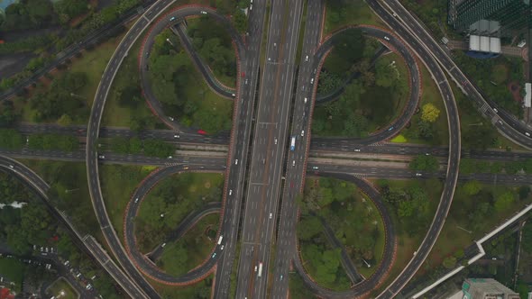 Top Down Overhead Aerial View of Busy Car Traffic on a Modern Large Multi Lane Intersection on a alt