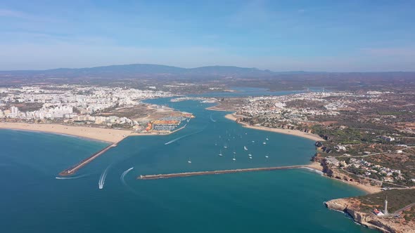Aerial View of the Bay of the Portuguese Marina in the Tourist Town of Portimao Breakwaters and alt