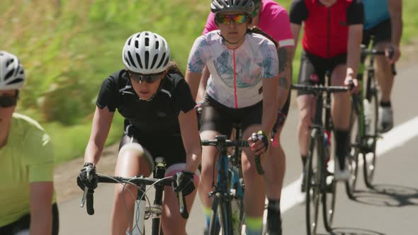 Group of cyclists on road.  Fully released for commercial use.