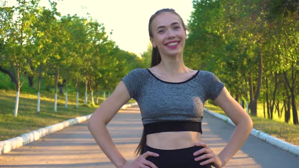 Portrait of Sporty Athletic Woman in Sportswear Looking in Camera.