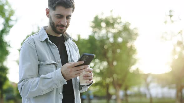 Bearded Man Holding Smartphone Standing Outside Digital Technology Applications and Solutions