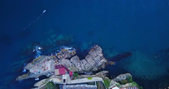 Aerial drone view of a small fishing village in Montenegro. alt