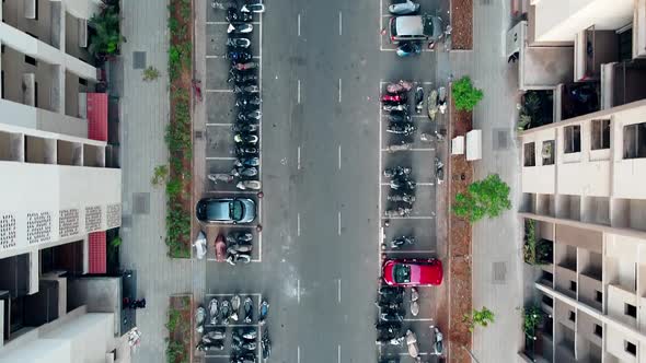 Aerial view of vehicles parked near building in India